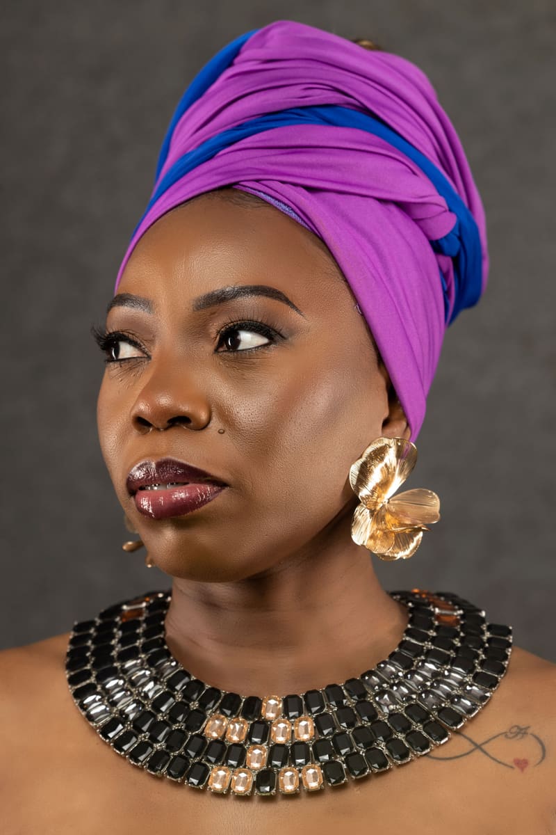 Woman in Purple Headwrap — Angola