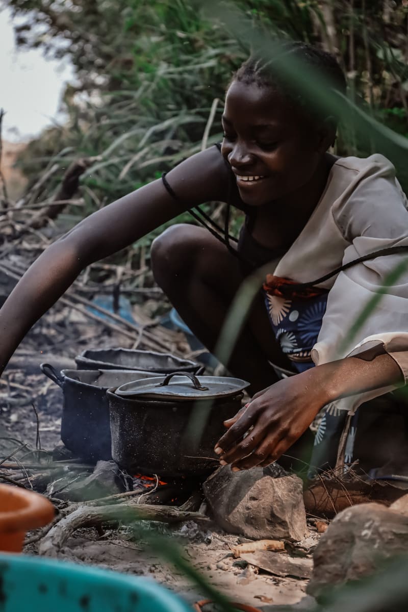 Girl Cooking Outdoors — Angola